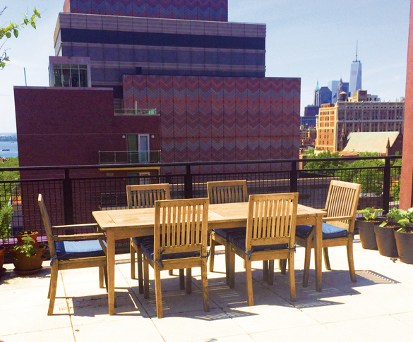 teak outdoor furniture on a rooftop in New York